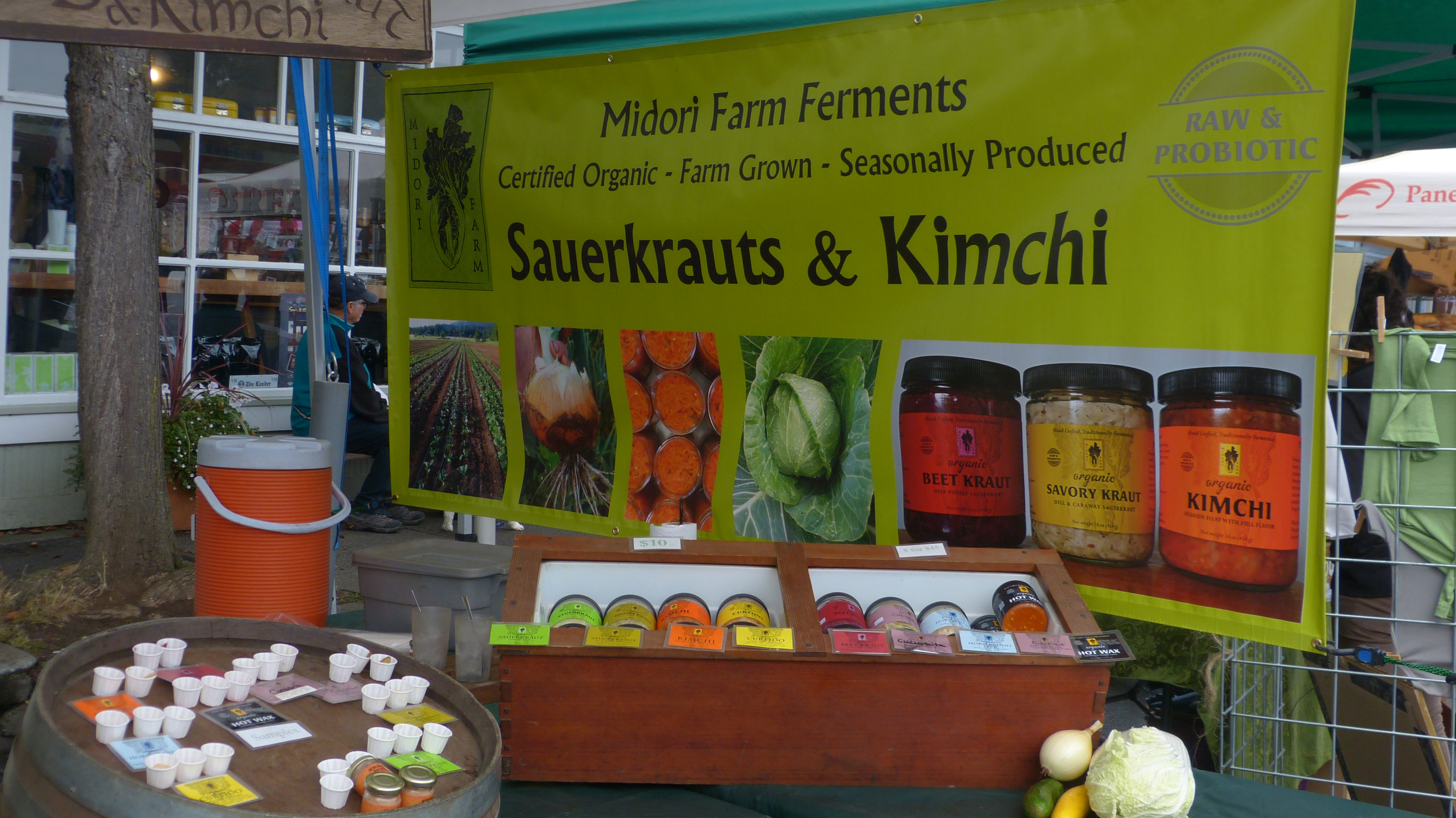 Farmer's Market stall with Midori Farms Sauerkrauts and Kimchi.